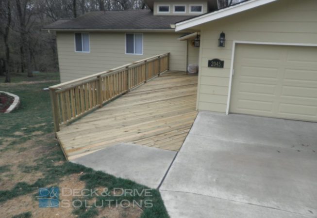 treated deck next to driveway
