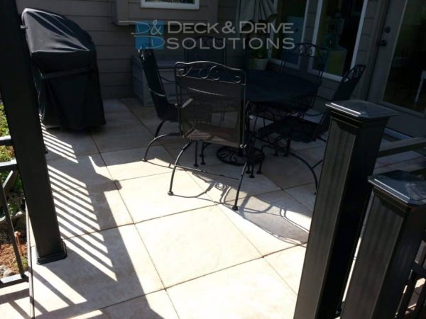 stone tile deck floor with wrought iron furniture