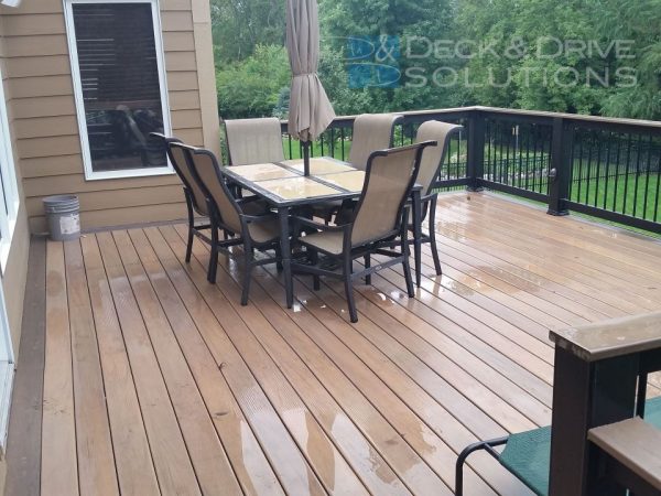 deck table and chairs on wet composite decking