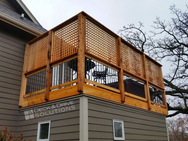 cedar deck with storage room below and privacy wall lattice above