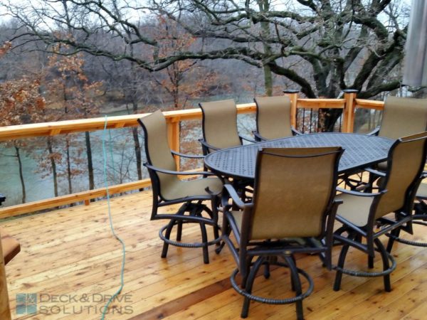 Cedar Deck with Glass Railing and patio set overlooking the river