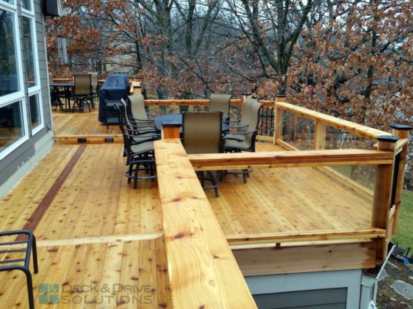 cedar deck top cap overlooking 2nd level deck with table and chairs