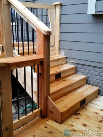 cedar stairs with stair riser lights