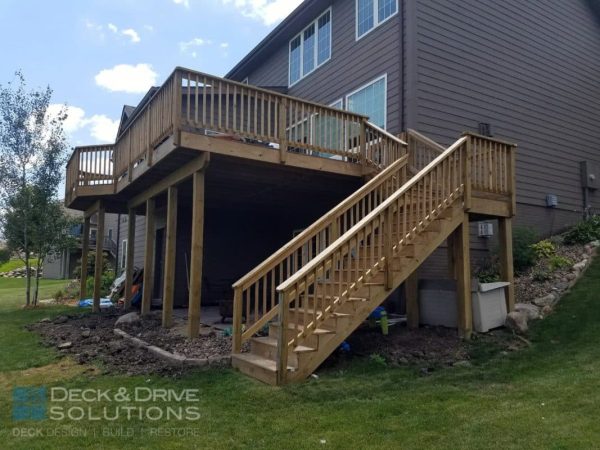 treated deck stairs with treated post rail and wood spindles