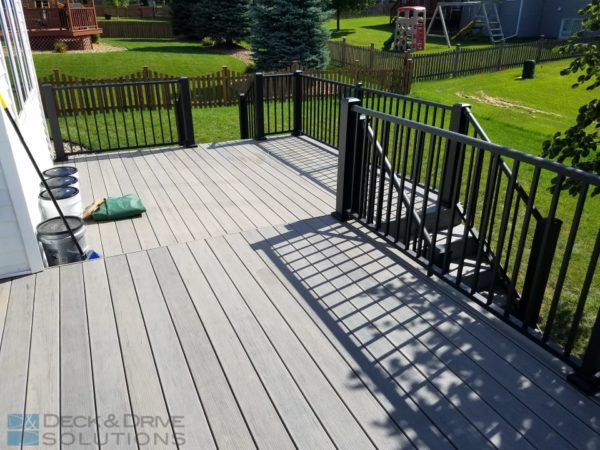 gray composite decking Ashwood with railing shadow