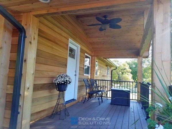 Covered Deck with cedar wall and cedar ceiling, including ceiling fan and seating