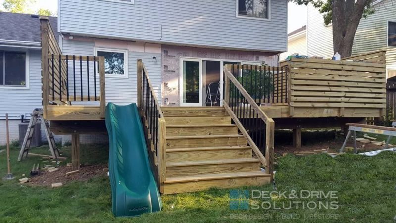 Deck Stairs with Slide on this custom treated deck