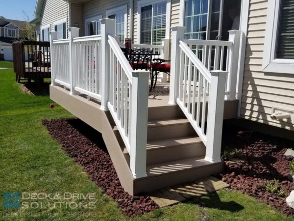 White Composite Railing from Timbertech and Sandy Birch Decking on deck stairs