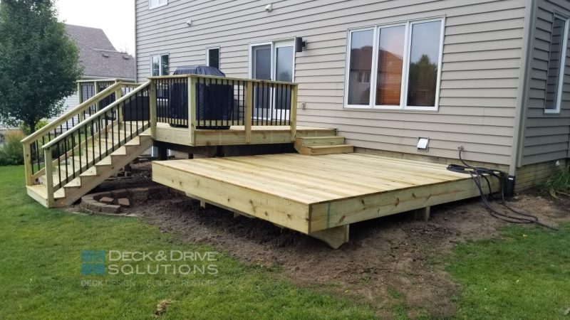 Treated Platform deck without railing for hot tub next to deck resurface
