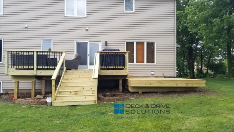 Treated Platform deck without railing for hot tub next to deck resurface