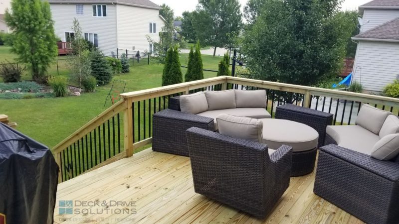 Outdoor deck furniture on treated deck