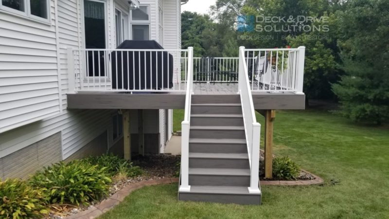 Silver maple gray composite deck stairs with white railing