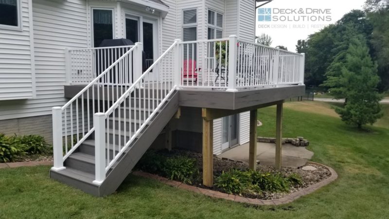 white metal railing with white house and Silver Maple Decking