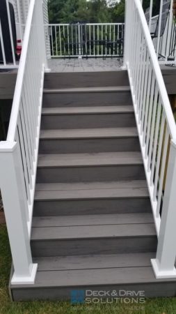 Silver maple gray composite deck stairs with white railing