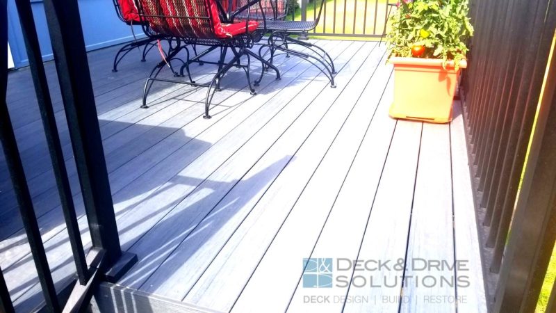 Deck boards are Timbertech Tropical Series - Amazon Mist with red chairs on background