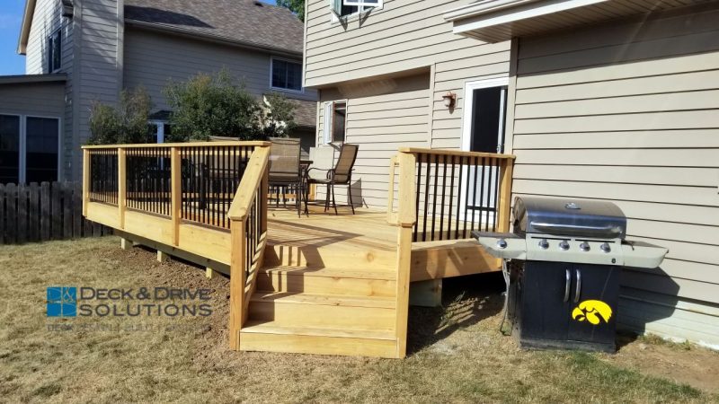 Cedar deck stairs leading to backyard