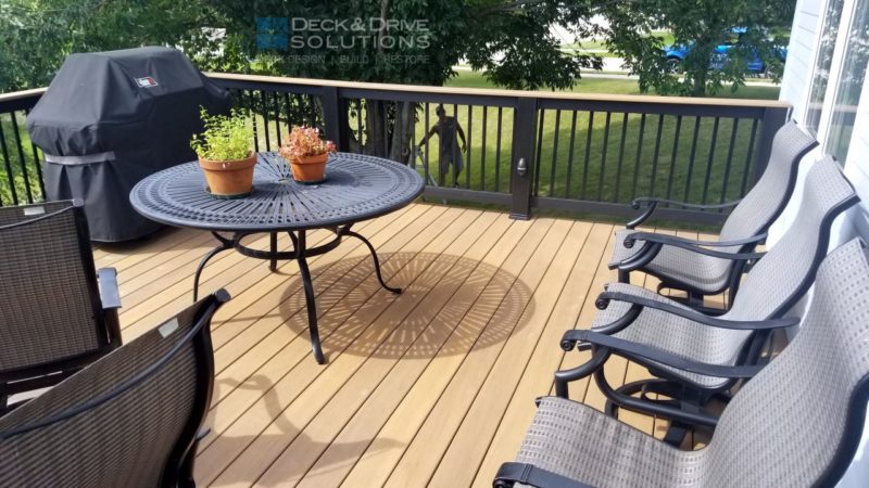 Timbertech composite Tigerwood decking with table and flowers