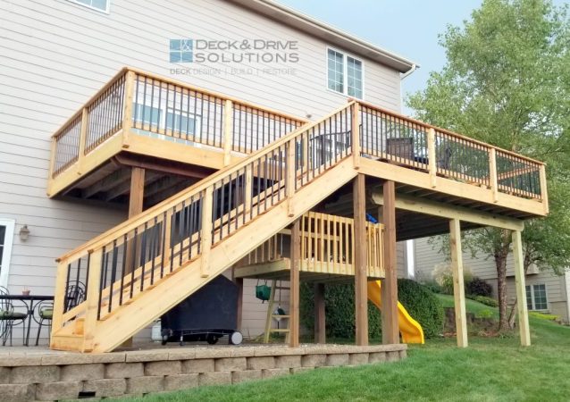 New construction cedar walkout deck with slide below