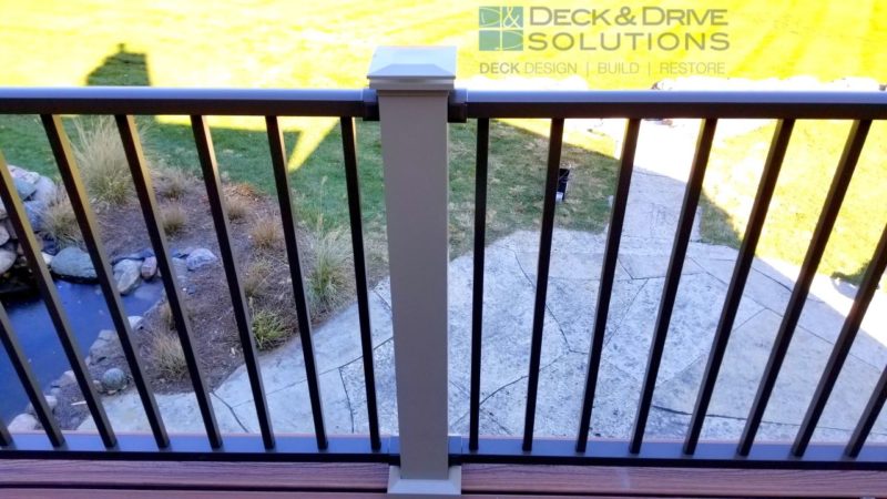 Trex Transcend Decking - Tiki Torch with Clay Westbury 4" post and natural stone patio below