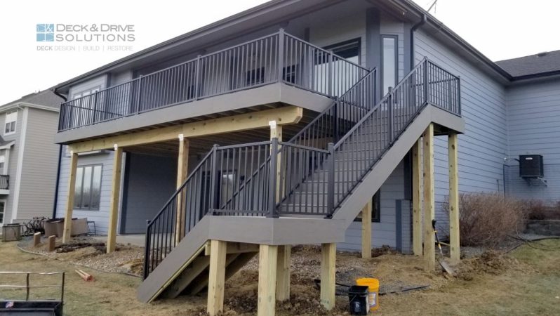 Timbertech Terrain Silver Maple on Black metal railing, Deck stairs with center landing, partially covered deck