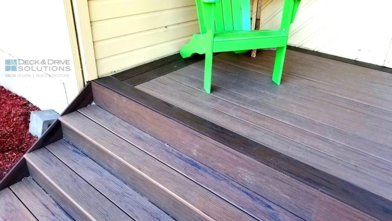 Front Porch with wide stairs using Timbertech composite decking in Pecan and Mocha, Front Porch with green chair on yellow house