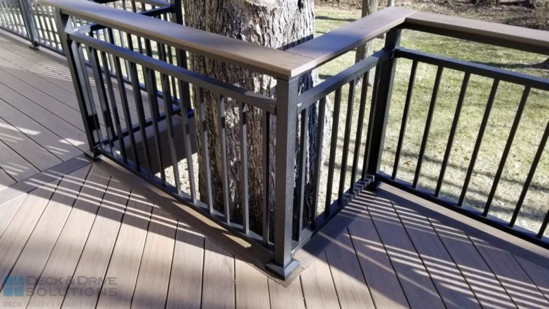 corner of metal deck railing with top cap deck board