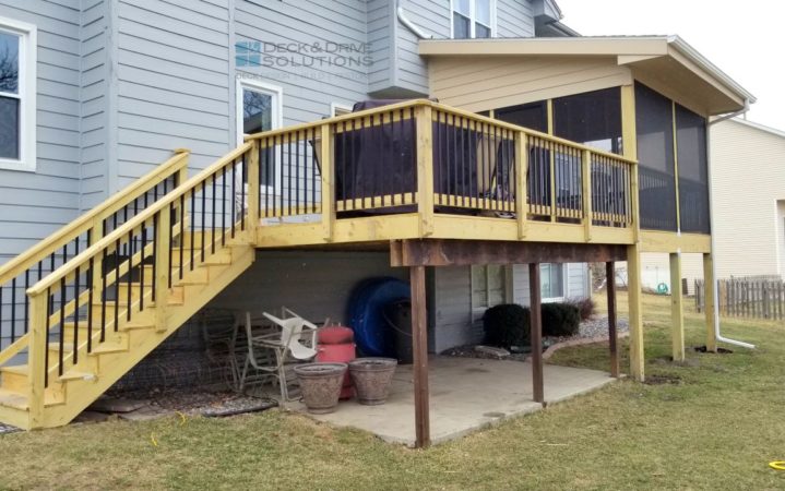 Treated deck next to new partially covered deck