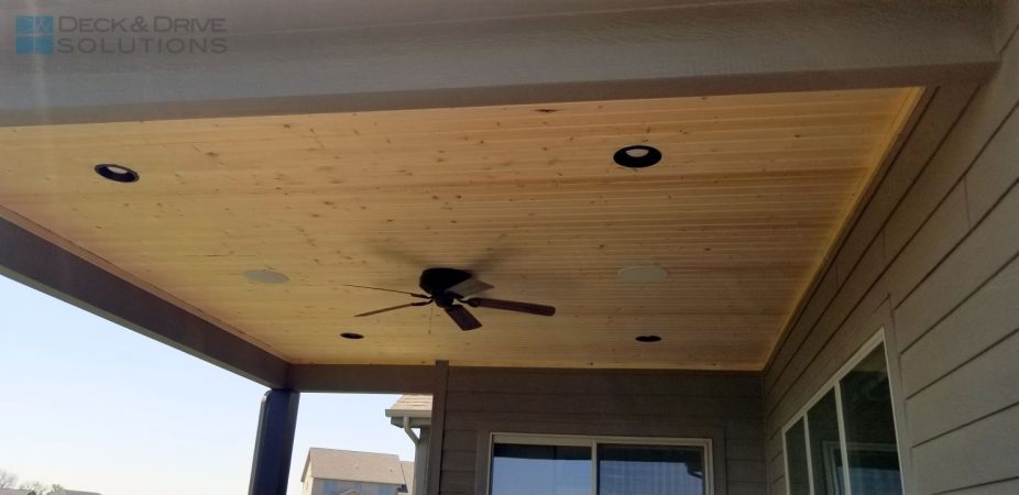 Pine Ceiling under deck roof with ceiling fan and lights