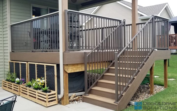 Daylight covered porch with composite stairs and bronze aluminum railing