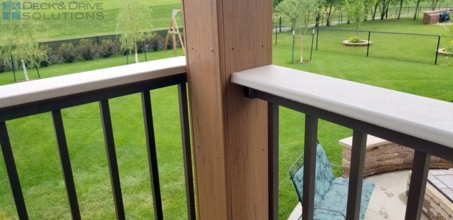 White Wash Cedar Timbertech Drink rail on bronze railing connected to wrapped post in mocha