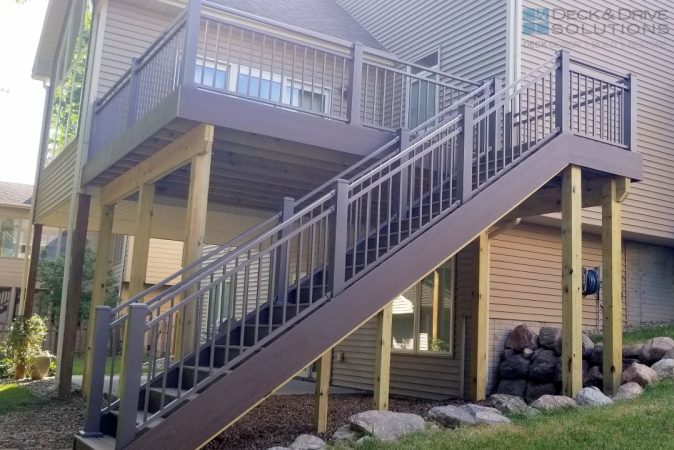 Deck stairs with large post and Bronze Rivera Railing