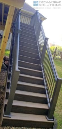 Deck stairs with large post and Bronze Rivera Railing