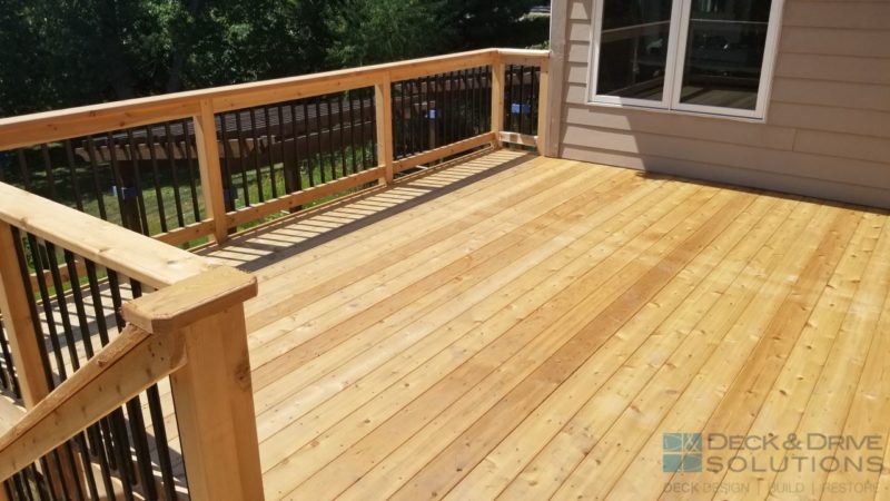 Cedar Decking and Cedar Post Rail with Black Traditional Spindles