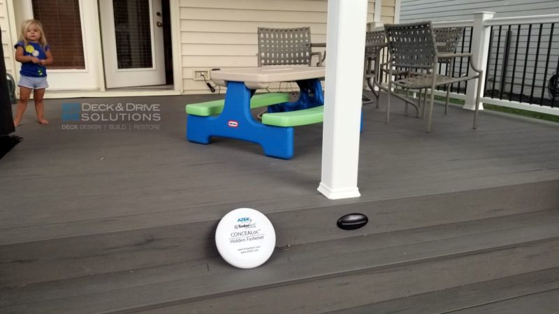Timbertech frisbee sitting on deck stairs