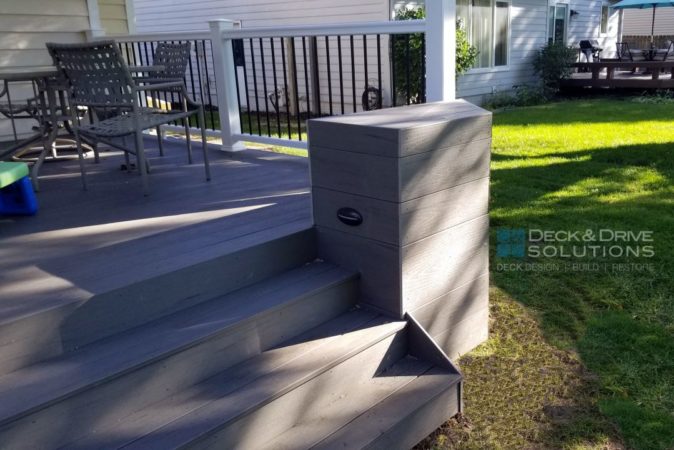 deck light on planter base next to stairs on a deck