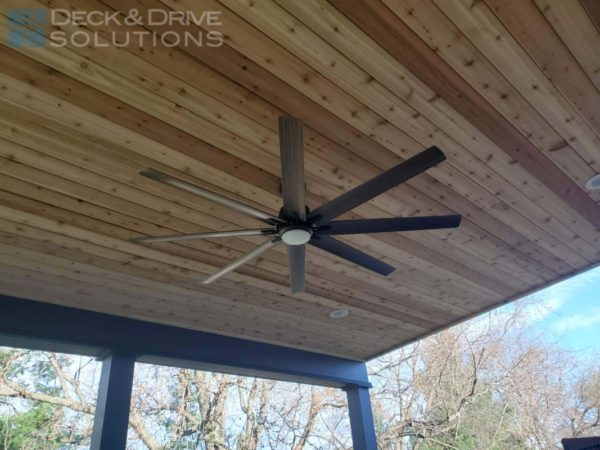 large ceiling fan under lean to roof with cedar ceiling