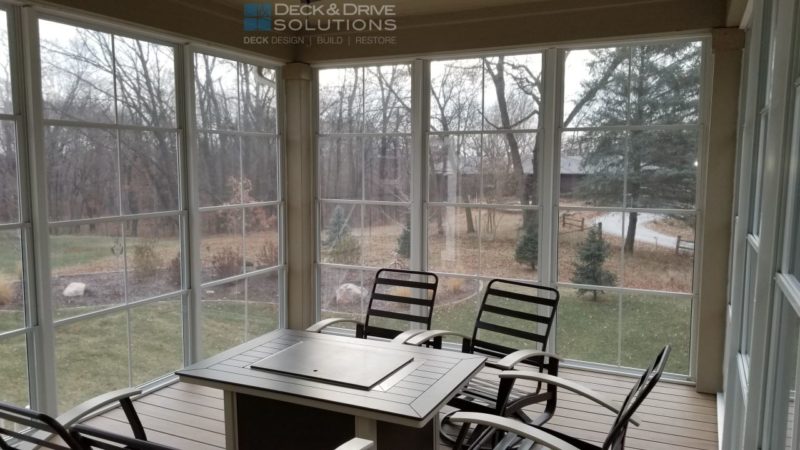 inside deck room with outdoor fireplace and seating