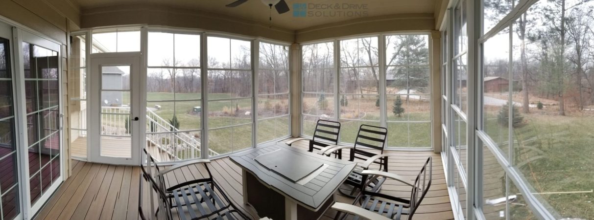 EzeBreezeinside deck room with outdoor fireplace and seating
