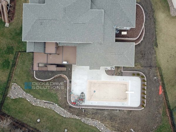 Large deck with inground pool in backyard