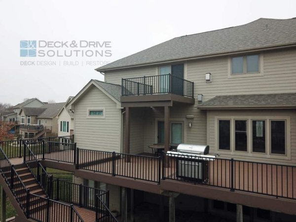 Large walkout composite deck with upper balcony