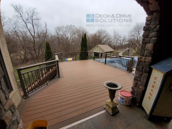 New Deck off lanai with composite decking and aluminum railing with drink rail