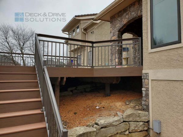 Retaining wall below deck with stairs