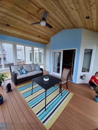 3 Seasons Covered Porch with Cedar Ceiling, Blue Siding Walls, and Timbertech Antigua Gold Deck Flooring