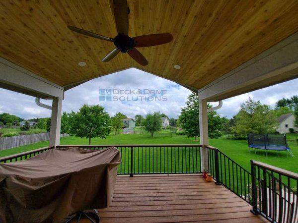 looking out back of covered deck with trex decking and cedar ceiling