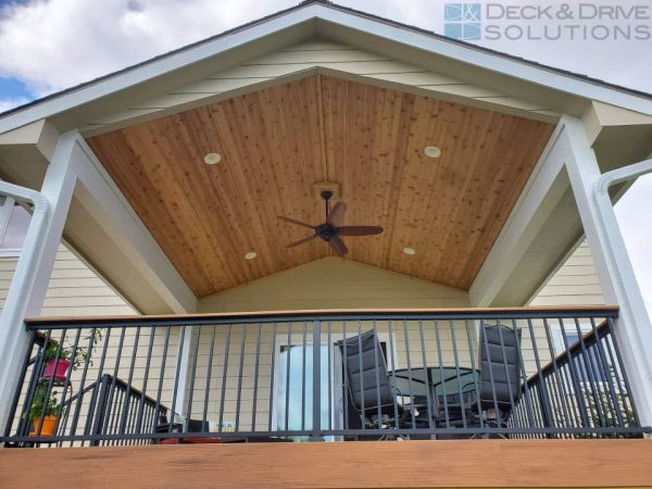 cedar ceiling under deck roof with westbury railing and drink rail trex, and composite deck fascia