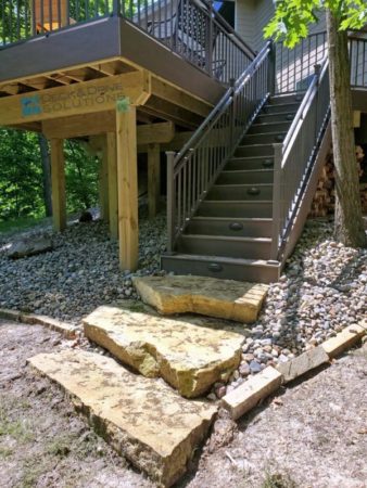 Natural Stone at the bottom of deck stairs