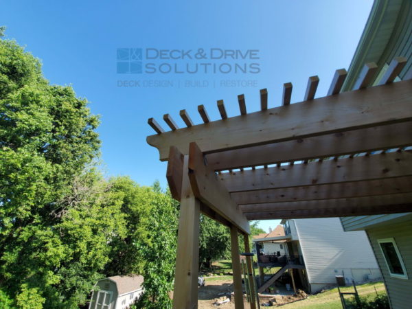 Cedar pergola on top of trex deck