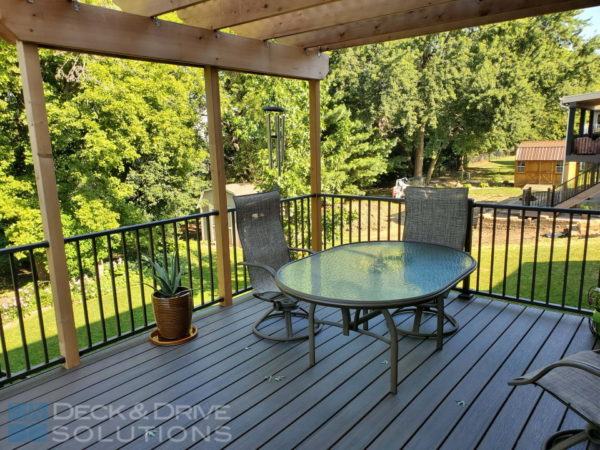 Above View of Cedar Pergola above a Trex Composite Deck, outdoor table and chairs with few flower pots