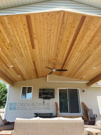 cedar ceiling under deck roof with ceiling fan and lights