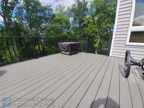 Timbertech Deck Silver Maple with black railing and trees in background